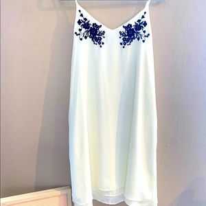 White dress with black lace design